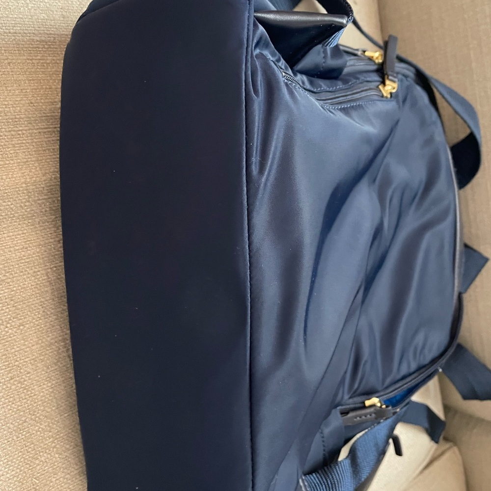 Perfect condition Tory Burch navy back pack.